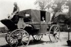 Alan Cottingham siting on front of &quot;Stage Coach&quot; Nellie inside coach. 1936.