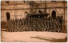 Rodi Garganico Rest Camp occupants and staff. Frank is just to our left of the left of the two Officers on chairs centre front